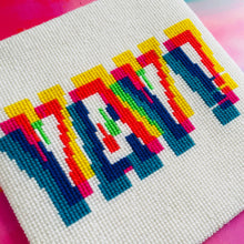 Load image into Gallery viewer, Cross-stitched colorful pattern on fabric with a pink background
